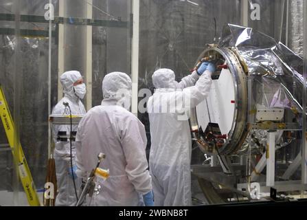 Engineers and IRIS-Pegasus launch team members re-verify NASA’s IRIS spacecraft in a Vandenberg hangar ahead of the next flight simulation. Scheduled for launch on a Pegasus XL rocket no earlier than June 26, 2013, IRIS will trace energy and plasma flow through the Sun’s chromosphere, transition region, and corona using spectrometry and imaging to study the heliosphere and Sun-to-Earth connection. Stock Photo