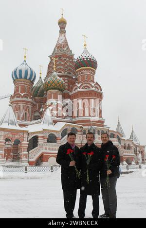 Expedition 34/35 Soyuz Commander Roman Romanenko (left), Flight Engineer Chris Hadfield of the Canadian Space Agency (center) and Flight Engineer Tom Marshburn of NASA pose for pictures in front of St. Basil’s Cathedral in Moscow Nov. 29, 2012 during a tour of Red Square during which they laid flowers at the Kremlin Wall where Russian space heroes are interred. The trio will launch to the International Space Station Dec. 19 from the Baikonur Cosmodrome in Kazakhstan in their Soyuz TMA-07M spacecraft. NASA/Stephanie Stoll Stock Photo