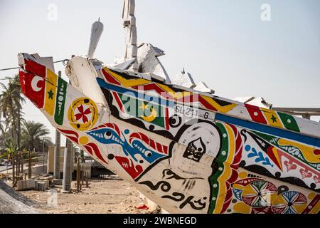 West Africa, Senegal, Saint Louis. The painted prow of a fishing boat or pirogue on the River Senegal estuary. Stock Photo