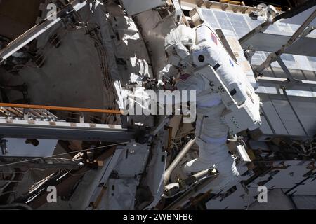 NASA astronaut Loral O'Hara, Expedition 70 flight engineer, is pictured during a spacewalk on November 1, 2023, at the International Space Station replacing a trundle bearing assembly on the port solar alpha rotary joint. The joint enables the solar arrays to track the Sun and provide electrical power to the station. Stock Photo