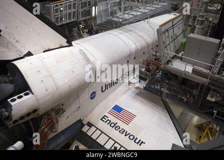 CAPE CANAVERAL, Fla. - At NASA's Kennedy Space Center in Florida, space shuttle Endeavour arrives in Orbiter Processing Facility-2. Endeavour's touchdown at Kennedy's Shuttle Landing Facility following the STS-130 mission to the International Space Station was at 10 20 p.m. EST Feb. 21. Processing now will begin for Endeavour's next flight, STS-134. The six-member STS-134 crew will deliver Express Logistics Carrier 3 and the Alpha Magnetic Spectrometer to the International Space Station, as well as a variety of spare parts including two S-band communications antennas, a high-pressure gas tank, Stock Photo