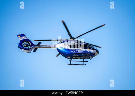 Police helicopter, Airbus Helicopters H145, of the NRW state police, after take-off at Düsseldorf Airport, police flight squadron, Stock Photo