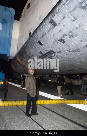 CAPE CANAVERAL, Fla. - NASA Administrator Charles Bolden examines the thermal protection system tiles under space shuttle Endeavour following its successful landing on Runway 15 at the Shuttle Landing Facility at NASA's Kennedy Space Center in Florida. After 14 days in space, Endeavour's 5.7-million-mile STS-130 mission was completed on orbit 217. Main gear touchdown was at 10 20 31 p.m. EST followed by nose gear touchdown at 10 20 39 p.m. and wheels stop at 10 22 10 p.m. It was the 23rd night landing in shuttle history and the 17th at Kennedy. During Endeavour's STS-130 mission, astronauts in Stock Photo