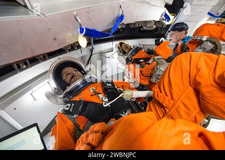 NASA engineers at Johnson Space Center tested crews inside an Orion spacecraft mockup using rotational hand controllers and cursor control devices while wearing Modified Advanced Crew Escape spacesuits on March 24, 2016. The devices allow operation of Orion’s displays and control systems for maneuvering and mission tasks, providing data to ensure astronauts can properly use the controls in their suits. Stock Photo
