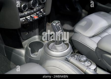 Close-up view of a modern car's automatic gearbox and intuitive control buttons in an electric vehicle (EV). This scene showcases the seamless fusion Stock Photo