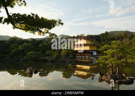 The sunsets on Kinkaku-ji, the Golden temple, in Kyoto, Japan, October 2023. The sight is one of the most popular tourist sights in Japan. Stock Photo