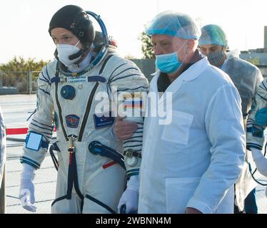 Expedition 64 Russian cosmonaut Sergey Kud-Sverchkov walks to board the Soyuz MS-17 spacecraft prior to launch with Sergey Ryzhikov of Roscosmos and Kate Rubins of NASA, Wednesday, Oct. 14, 2020, at the Baikonur Cosmodrome in Kazakhstan.  The trio launched at 1:45 a.m. EDT to begin a six-month mission aboard the International Space Station. Stock Photo