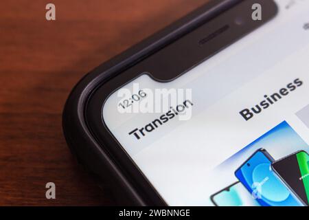 Logo of Transsion, Chinese mobile phone manufacturer based in Shenzhen, in iPhone. It’s known as the one of largest smartphone manufacture in Africa Stock Photo