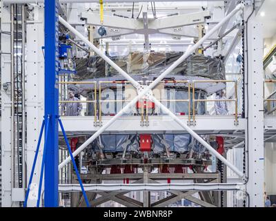 At Kennedy Space Center, Lockheed Martin workers deploy the solar array ...