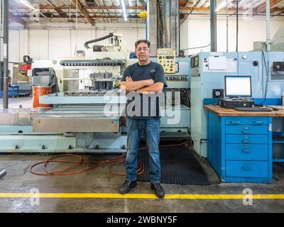 Parts for the Orion crew module which will carry astronauts on Artemis II are machined at Aerospace Engineering Corporation in California on June 18, 2018. Stock Photo