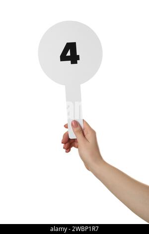 Woman holding auction paddle with number 4 on white background, closeup Stock Photo