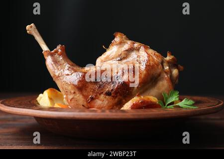 Tasty cooked rabbit meat with potatoes on table, closeup Stock Photo
