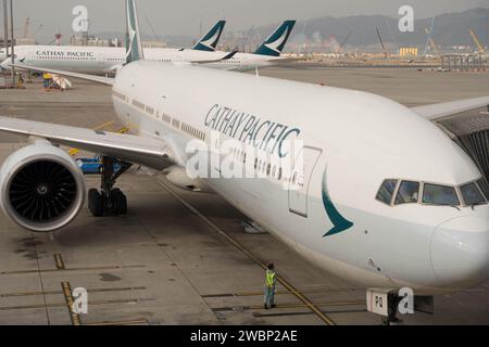 front to back view of Cathay Pacific aircraft parked  on tarmac apron at Hong Kong international Airport， China Stock Photo