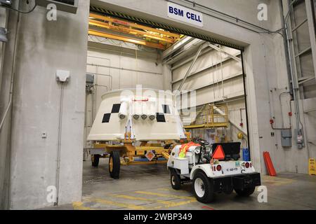 Inside the Booster Fabrication Facility at NASA's Kennedy Space Center in Florida, the Artemis I aft skirts for the agency's Space Launch System (SLS) rocket’s twin solid rocket boosters are being readied for their move to the Rotation, Processing and Surge Facility (RPSF) on June 9, 2020. In view, the left aft skirt assembly is attached to a move vehicle in a test cell. The aft skirts were refurbished by Northrop Grumman. They house the thrust vector control system, which controls 70 percent of the steering during initial ascent of the SLS rocket. The segments will remain in the RPSF until re Stock Photo
