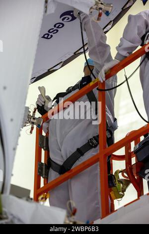 Inside the Neil Armstrong Operations and Checkout Building high bay at Kennedy Space Center, ASRC technician Frank Pelkey works to adhere the European Space Agency (ESA) logo to the aft wall of Orion’s crew module adapter on Sept. 20, 2020, ahead of NASA’s Artemis I mission. The first in a series of increasingly complex missions, Artemis I will test the Orion spacecraft and Space Launch System as an integrated system ahead of crewed flights to the Moon. Under the Artemis program, NASA will land the first woman and the next man on the Moon by 2024. Stock Photo