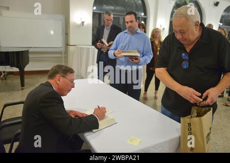 Miami, USA. 10th Jan, 2024. MIAMI, FLORIDA - JANUARY 10: Retired United States Army General and former CIA director David Petraeus sign copies of his books at an evening with General David Petraeus in conversation with Don Morrison presented by Books and Books about General David Petraeus book 'Conflict: The Evolution of Warfare from 1945 to Ukraine' at Coral Gables Congregational United Church of Christ on January 10, 2024 in Miami, Florida. (Photo by JL/Sipa USA) Credit: Sipa USA/Alamy Live News Stock Photo
