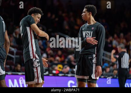 Washington State Cougars guard Isaiah Watts (12) and forward Jaylen Wells (0) celebrate during a NCAA men’s basketball game against the USC Trojans, W Stock Photo