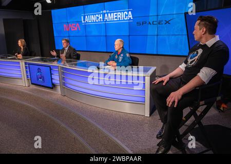 Inside the Press Site auditorium at NASA’s Kennedy Space Center in Florida, NASA and SpaceX officials conduct a postlaunch news conference on May 30, 2020, following the launch of the agency’s SpaceX Demo-2 mission to the International Space Station. From left are: Commercial Crew Program Manager Kathy Lueders; International Space Station Program Manager Kirk Shireman; NASA Chief Astronaut Pat Forrester; and Chief Engineer Elon Musk. Liftoff of the SpaceX Falcon 9 rocket and Crew Dragon spacecraft, carrying NASA astronauts Robert Behnken and Douglas Hurley, occurred at 3:22 p.m. EDT from histo Stock Photo