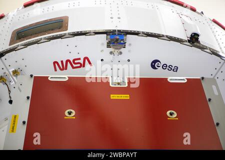 Inside the Neil Armstrong Operations and Checkout Building high bay at Kennedy Space Center, NASA’s iconic “worm” logo and European Space Agency (ESA) logo have been added to the aft wall of Orion’s crew module adapter ahead of NASA’s Artemis I mission. Originally created by the firm of Danne & Blackburn, the “worm” logo’s bold, sleek design was officially introduced in 1975 and was incorporated into many of the agency’s next-generation programs. It was retired in 1992, but has made a comeback in 2020 as the agency ushers in a new, modern era of human spaceflight. The Orion spacecraft is being Stock Photo