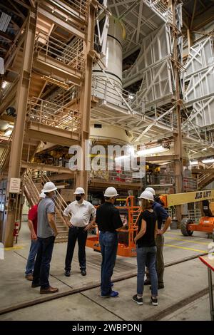 Kathy Lueders, at right, NASA’s associate administrator for Human Exploration and Operations, along with members of the Exploration Ground Systems and Jacobs Technology leadership view Artemis hardware inside the Rotation, Processing and Surge Facility (RPSF) at the agency’s Kennedy Space Center in Florida on June 25, 2020. Manufactured by Northrop Grumman in Utah, the solid rocket booster segments for the Space Launch System rocket are in view. The first in a series of increasingly complex missions, Artemis I will test the Orion spacecraft and SLS as an integrated system ahead of crewed fligh Stock Photo