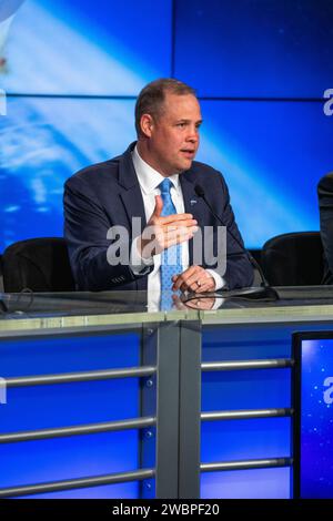 NASA Administrator Jim Bridenstine speaks during a briefing at the agency’s Kennedy Space Center in Florida following the uncrewed In-Flight Abort Test on Jan. 19, 2020. From left to right are Kathy Lueders, program manager, NASA’s Commercial Crew Program; Bridenstine; and Elon Musk, chief engineer, SpaceX. During the flight test, a SpaceX Falcon 9 rocket and Crew Dragon spacecraft lifted off from Kennedy’s Launch Complex 39A and began a planned launch-abort sequence demonstrating the spacecraft’s escape capabilities. The Crew Dragon splashed down in the Atlantic Ocean as expected. The In-Flig Stock Photo