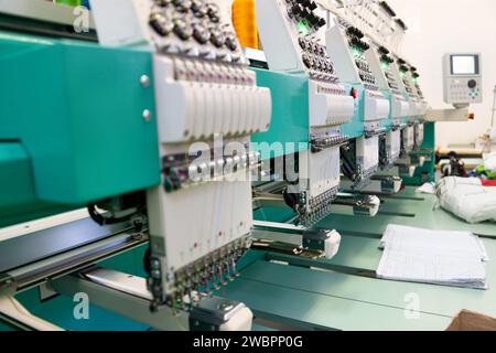 multi head embroidery machine, at work in a textile factory Stock Photo