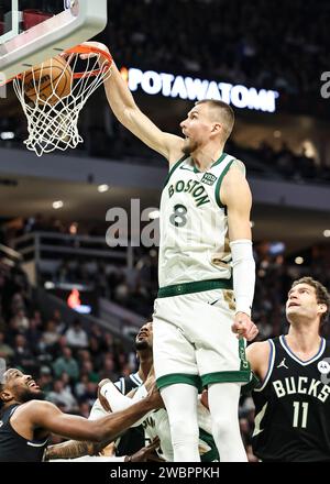 Milwaukee, USA. 11th Jan, 2024. Boston Celtics center Kristaps Porzingis (top) dunks during the NBA regular season game between Milwaukee Bucks and Boston Celtics in Milwaukee, the United States, Jan. 11, 2024. Credit: Joel Lerner/Xinhua/Alamy Live News Stock Photo