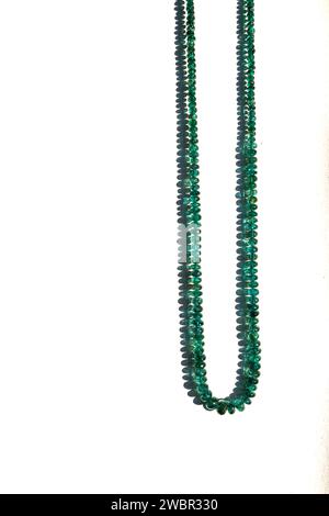 Traditional indian nackace with emerald beeds from Rajasthan region, white backbround. Stock Photo