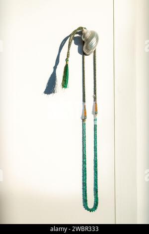 Traditional indian nackace with emerald beeds from Rajasthan region, white backbround. Stock Photo