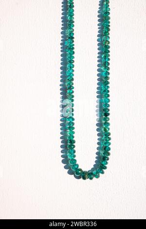 Traditional indian nackace with emerald beeds from Rajasthan region, white backbround. Stock Photo