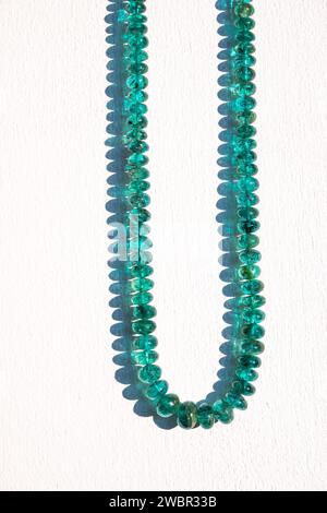 Traditional indian nackace with emerald beeds from Rajasthan region, white backbround. Stock Photo