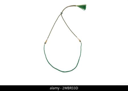 Traditional indian nackace with emerald beeds from Rajasthan region, white backbround. Stock Photo