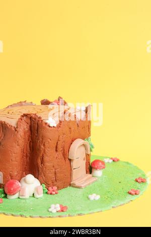 Easter log cake with textured look on the tree trunk and Easter bunny Stock Photo