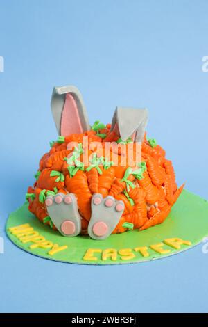 Carrot covered Easter bunny cake, happy Easter concept Stock Photo