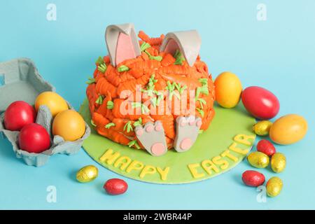 Carrot covered Easter bunny cake, happy Easter concept Stock Photo
