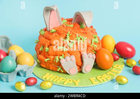 Carrot covered Easter bunny cake, happy Easter concept Stock Photo