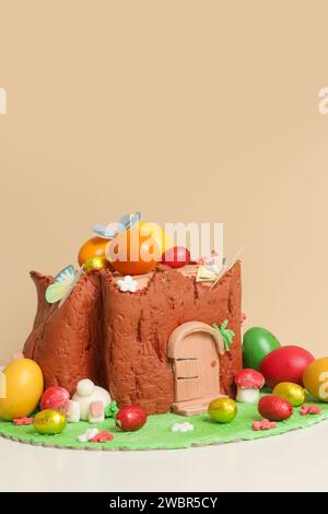 Easter log cake with textured look on the tree trunk and Easter bunny Stock Photo