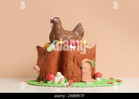 Easter log cake with textured look on the tree trunk and Easter bunny Stock Photo