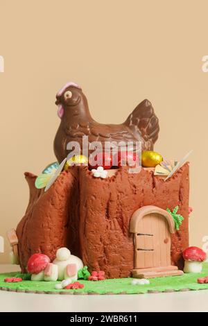 Easter log cake with textured look on the tree trunk and Easter bunny Stock Photo