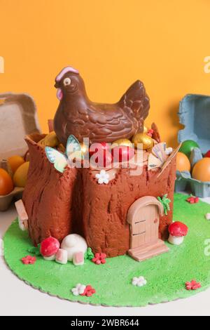 Easter log cake with textured look on the tree trunk and Easter bunny Stock Photo