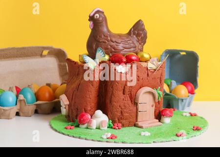 Easter log cake with textured look on the tree trunk and Easter bunny Stock Photo
