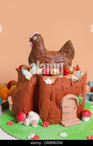 Easter log cake with textured look on the tree trunk and Easter bunny Stock Photo