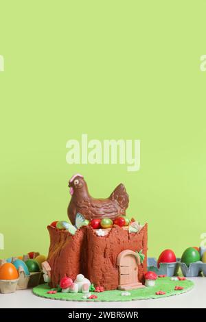 Easter log cake with textured look on the tree trunk and Easter bunny Stock Photo
