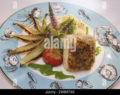 Square Pan fried fish fillet with roasted potato Stock Photo