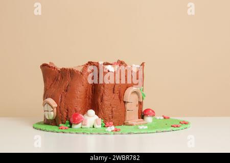 Easter log cake with textured look on the tree trunk and Easter bunny Stock Photo