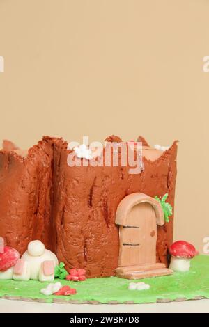 Easter log cake with textured look on the tree trunk and Easter bunny Stock Photo
