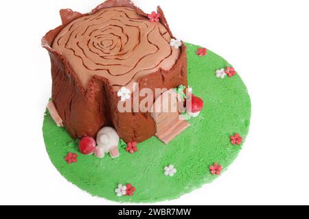 Easter log cake with textured look on the tree trunk and Easter bunny Stock Photo