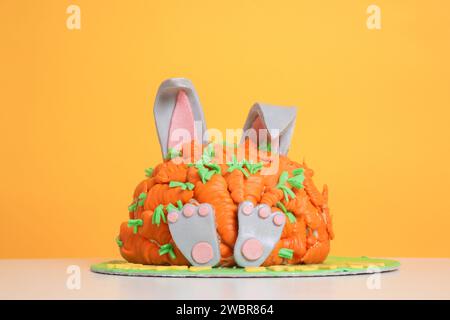 Carrot covered Easter bunny cake, happy Easter concept Stock Photo