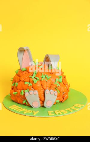 Carrot covered Easter bunny cake, happy Easter concept Stock Photo