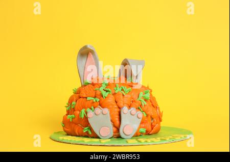 Carrot covered Easter bunny cake, happy Easter concept Stock Photo